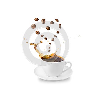 Cup with saucer with splash of coffee. Levitating coffee beans in shape of heart. Drink love concept