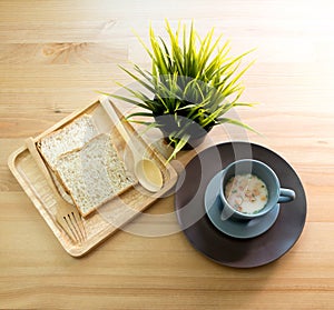 Cup soup with bread breakfast on the wood table