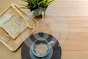 Cup soup with bread breakfast on the wood table