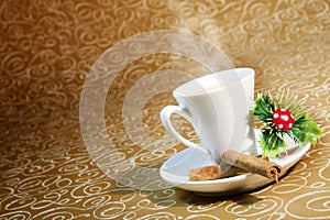 Cup of steaming coffee with Christmas motifs