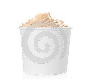 Cup with tasty frozen yogurt on background