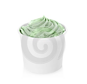 Cup with tasty frozen yogurt on white