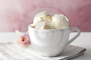 Cup with tasty vanilla ice cream