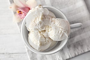 Cup with tasty vanilla ice cream