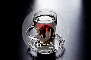 Cup of Tea Against Black Background