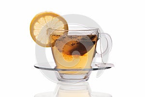 Cup of tea with lemon slice isolated on white background