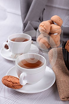 Cup of tea with biscuits and chocolate