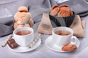 Cup of tea with biscuits and chocolate
