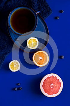 Cup of tea with citrus fruit