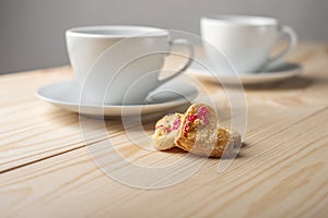 Cup of tea or coffee with heart shape cookies