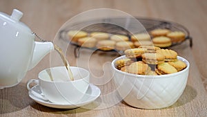 A cup of tea with cookies. Cookies with caramel dulce de leche.