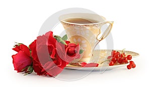 Cup of tea, cookies and rose.