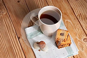 Cup of Tea with Cookies on wooden background