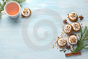 A cup of tea with fragrant honey Christmas gingerbreads with glaze and nuts