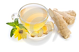 Cup of tea with ginger slices and Echinacea flower