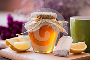 Cup of tea with honey and lemon background