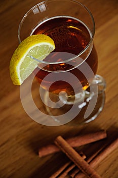 Cup of tea with lemon and cinnamon