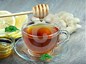 Cup of tea, lemon, ginger and mint. close-up. vitamin tea. cold and flu remedy.