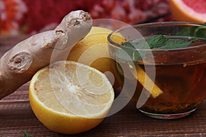 cup of tea  lemon and ginger root close-up on the table