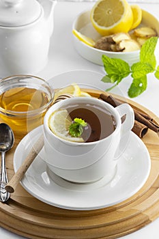 Cup tea with lemon and honey on a white background. Hot tea cup isolated, top view. Autumn, fall or winter drink. Copy space