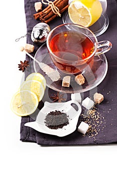 Cup of tea with lemon over white