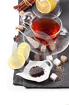 Cup of tea with lemon over white