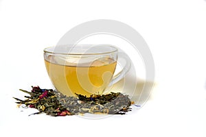 Cup of tea and loose tea on a white background.