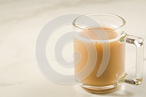 Cup of tea with milk/cup of tea with milk on a marble background, selective focus and copy space