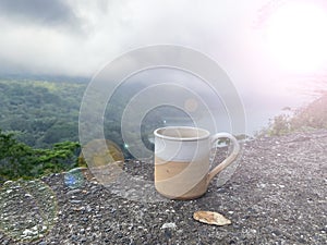 Cup of tea in the mountains. Relax on vacation with morning hot coffee or tea with nature view.