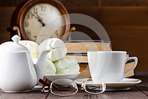 Cup of tea near old books