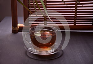Cup of tea in oriental style on a wooden table