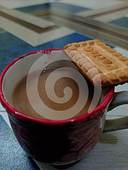 Cup of tea with Parle G photo