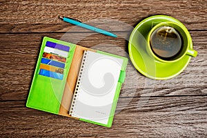 Cup of tea, pen, opened organizer