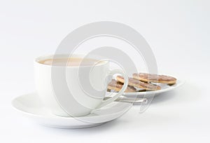 Cup of tea with plate of biscuits