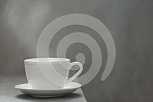 Cup of tea and saucer on table