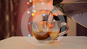 A Cup of tea with smoke on the background of bokeh. Christmas