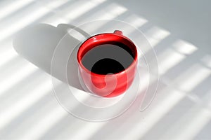 A cup of tea is on the table.