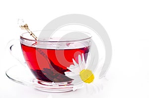 Cup of tea with teabag over white