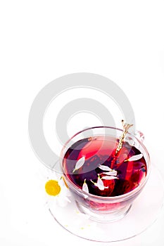 Cup of tea with teabag over white