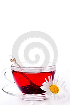 Cup of tea with teabag over white