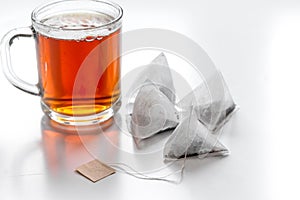 Cup of tea with teabags on white background mock up