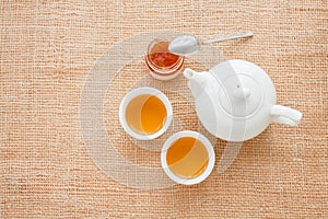 Cup of tea with teapot