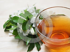 Cup of tea and white flower