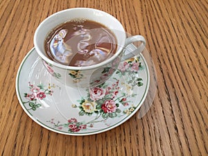 Black tea with milk in a classic Fine China cup