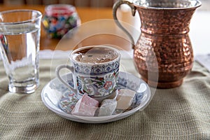 Cup of Turkish Coffee on a wooden table photo