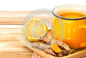 a cup of Turmeric Tea with lemon and ginger , Benefits for reduce Inflammation , Liver Detox and Cleanser healthy herb drink