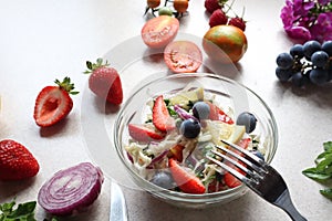 A Cup of vegetable salad with added berries, close - up-the concept of a healthy vegetable diet