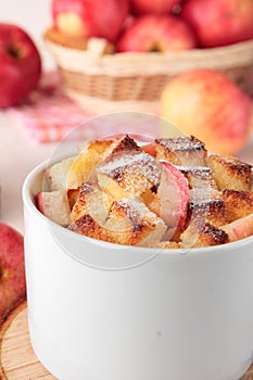Cup of wheat bread pudding with apples