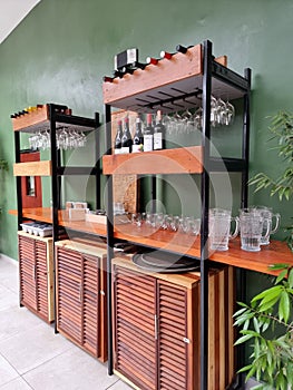 Cupboard with suspended goblets and bottles of wine