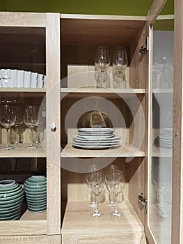 Cupboards that are filled with various household utensils